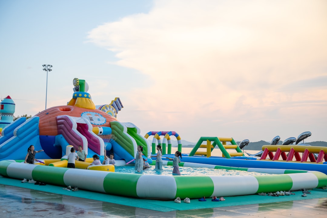Families enjoying a colorful water park attraction